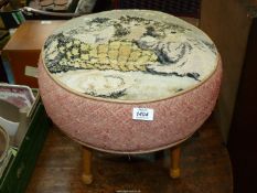 A 1940's circular Stool standing on turned legs, the top illustrating three kittens in a basket,
