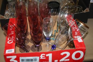 A quantity of Cranberry fluted champagne glasses, wine glasses with gilt rims, etc.