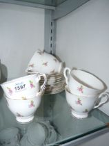 A vintage Royal Staffordshire fine bone china tea set in Scattered Rose pattern including six cups,