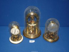 Three anniversary clocks including Kundo-Quartz and Schatz, all with plastic domes.