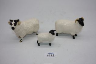 Two Beswick figures, Black and white face Ram and the other Black faced Ewe with lamb.