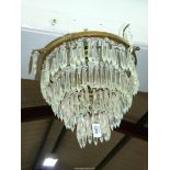 A four tier glass chandelier, 13" diameter (widest part at the top).