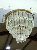 A four tier glass chandelier, 13" diameter (widest part at the top).