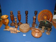 A box of treen to include candlesticks, vase, wooden box with floral design to lid,