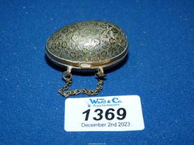 A very pretty egg shaped brass engraved thimble case.