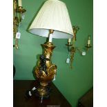 A decorative French gilt metal table lamp,