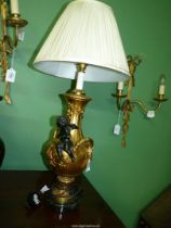 A decorative French gilt metal table lamp,