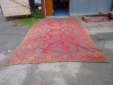 A large carpet in jewel colours. 172" x 114".