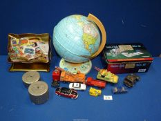A tin Chad Valley globe, collection of Matchbox labels, Midland Bank coin banks,