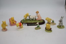 A quantity of figures from The Winnie the Pooh Collection; Eeyore loses a tail,