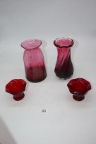 Four glass Vases - two being cranberry and two red.