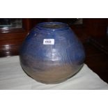 A heavy blue to beige Studio Pottery rounded vase with concentric circle pattern,