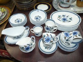 A part dinner, tea and coffee set by Alfred Meakin, in white having blue floral design,