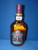 A 70 cl. bottle of Chivas Regal Scotch whisky, aged for 12 years in hand-crafted casks.
