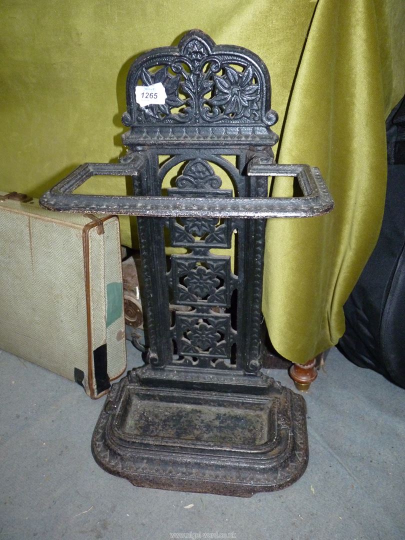 A black cast iron Stick/umbrella stand, 25 1/2'' high x 15'' wide.