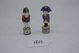 A pair of well modelled miniature porcelain caricature figures of Napoleon and Wellington,