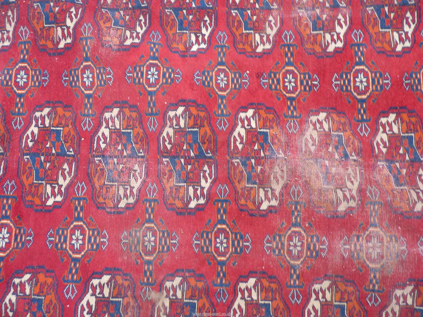 A large carpet in red and blue geometric design. 173" x 121". - Image 3 of 6