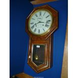 A William Oswin of Hereford, eight day trunk dial Wall Clock, 12" painted metal dial, with key,