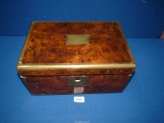 A burr Walnut writing Box with brass edging and escutcheon, complete with inkwells, lock a/f,