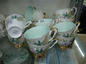 A 'Louise' Teaset by Queen Anne to include; ten plates, ten cups and eleven saucers,
