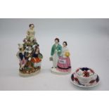 Two Staffordshire flat back figures and a Gaudy Welsh cup and saucer.