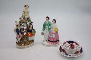 Two Staffordshire flat back figures and a Gaudy Welsh cup and saucer.