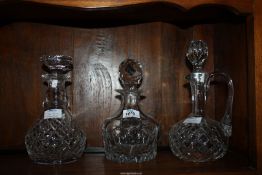 Two cut glass Decanters and one claret jug.