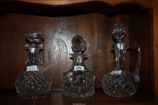 Two cut glass Decanters and one claret jug.