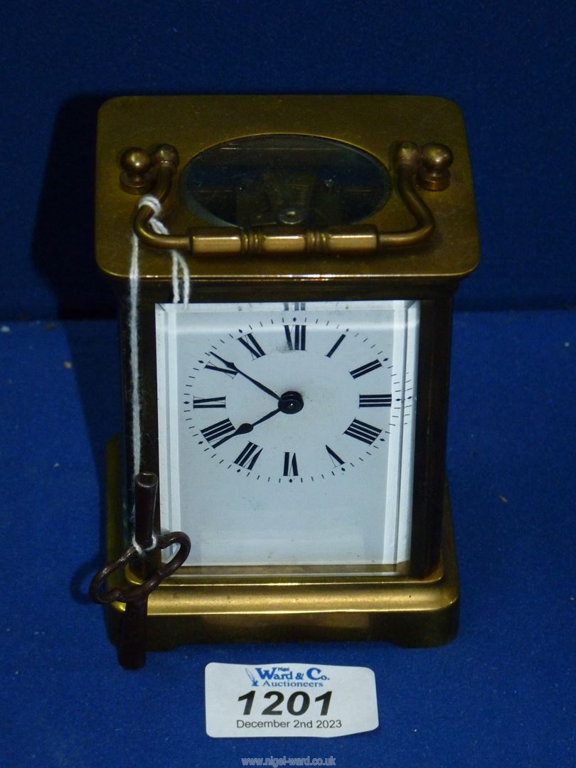 A Brass carriage Clock with key.