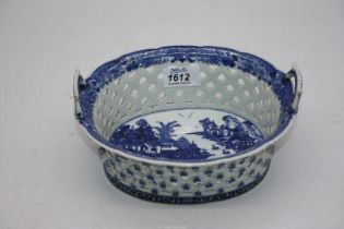 A Chinese 18th century blue and white porcelain chestnut basket, handles re-stuck.