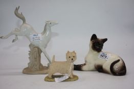 A Border Fine Arts Highland terrier stamped Ayres, Beswick reclining Siamese cat,