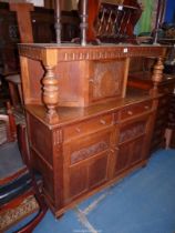 A Priory Oak style reproduction Court Cupboard having toggle door latches,