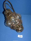 A bubble glass ceiling light with metal casing.