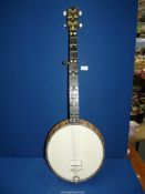A "Headmaster R-10" Banjo and case with spare strings.