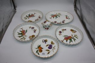 A quantity of Royal Worcester Evesham to include flan dishes, meat dish (a/f.) and preserve jar.