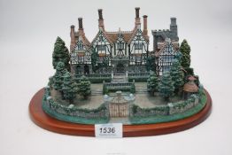 A Danbury Mint 'English Manor House' 11'' wide x 6 1/2'' high excluding base.