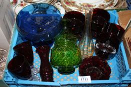 A quantity of coloured glass to include six dessert dishes and a green lidded jar,
