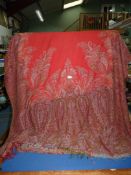 A Victorian paisley Shawl/throw, 128" long x 60" wide (some holes present).