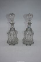 Two matching cut glass decanters.