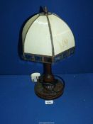 A Tiffany style lamp with plain cream shade, 19" tall.