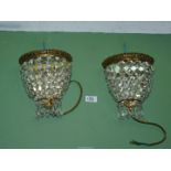 Two chandelier style glass wall lights with mirror backs, 8 3/4'' high approx.