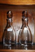 Two modern clear glass Decanters.