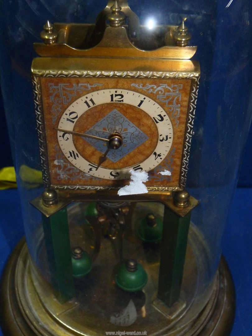 An Anniversary clock under a glass dome having Arabic numerals surrounding a patterned metal - Image 2 of 2