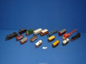 A small box of 'OO' trains/trucks including; United Dairies tanker, LMS engine and tender, etc.