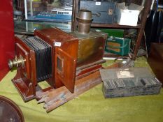 An 'Emil Busch' Magic Lantern with stand and slides.