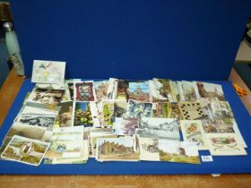 A quantity of old postcards.