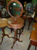 A Victorian campaign type Mahogany shaving Stand having a drum form top with a pair of hinged