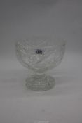 A large footed crystal bowl with star cuts and fruit detail, 8 1/2" high x 9" diameter.