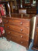 A 19th c Mahogany Chest of four long Drawers having turned knobs and standing on turned feet,