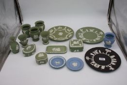 A tray of blue, green and black Wedgwood including plates, vases, pin trays, etc.
